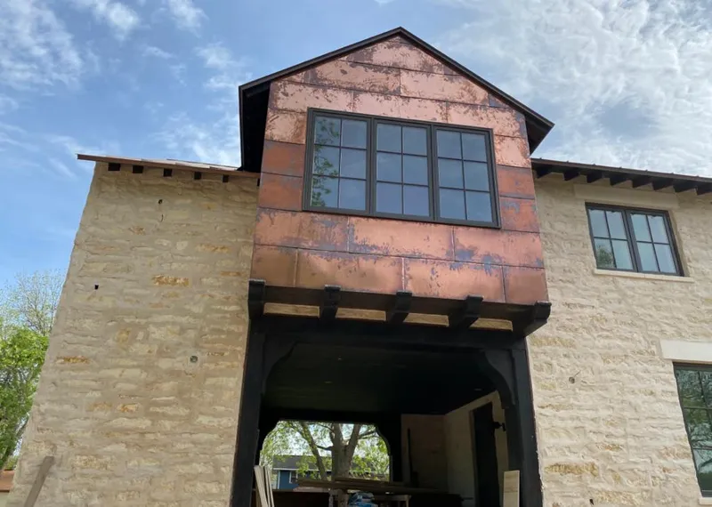 Copper metal panel facade on a stone building for Skylight Installation in Garfield Heights